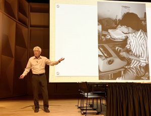 Shawn Wong with photo of himself at typewriter