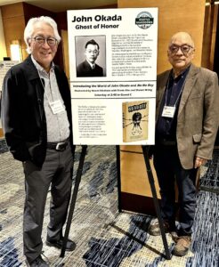 Two men with poster