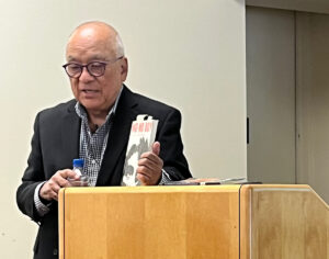 man speaking at podium
